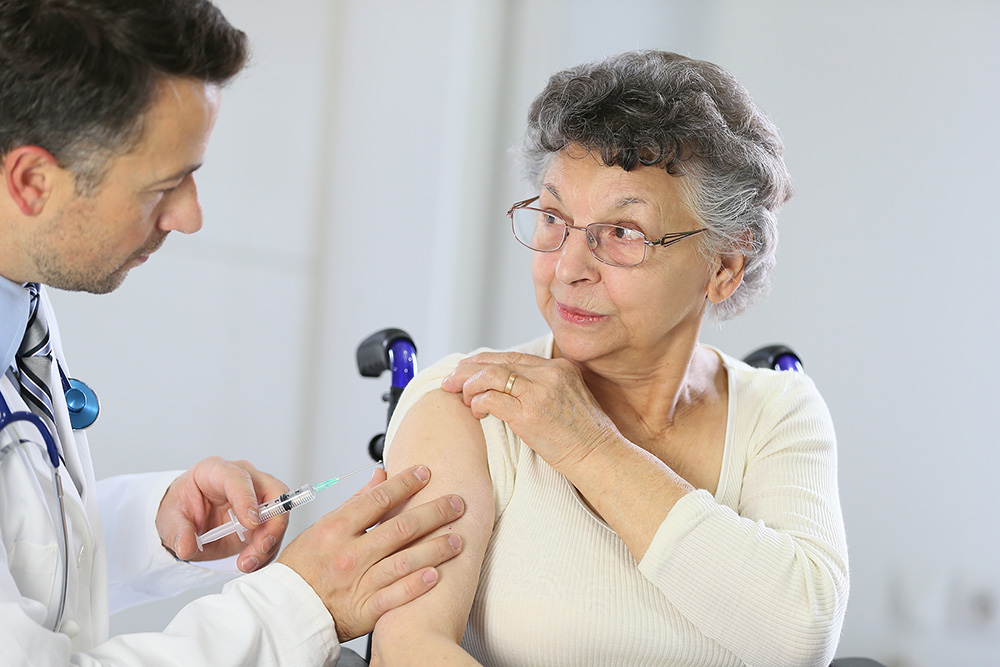 older lady getting flu vaccination