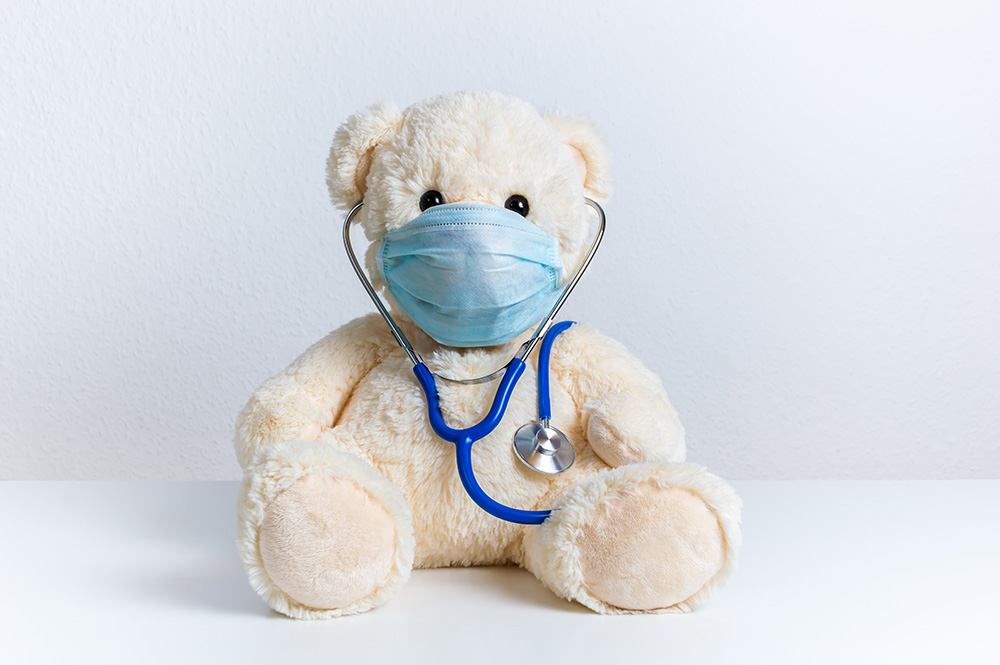 teddy bear wearing a surgical mask